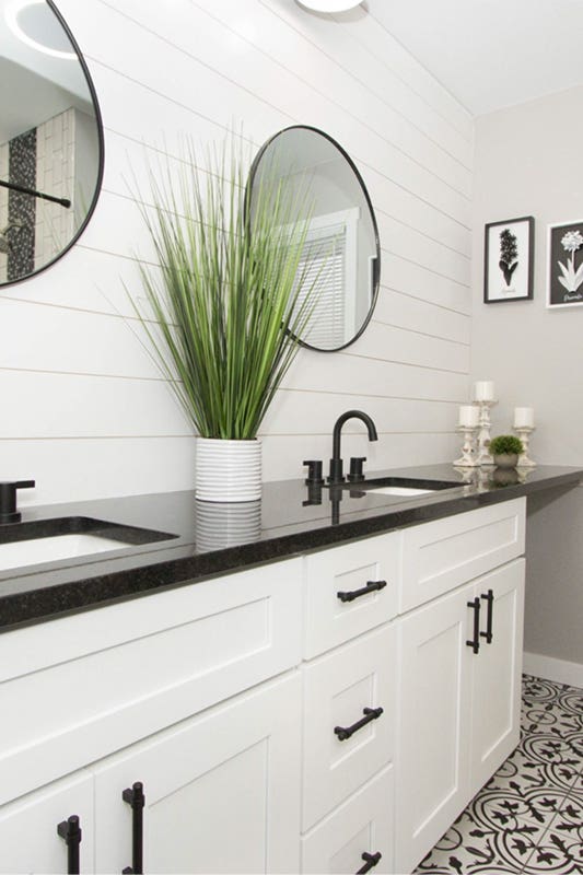 White cabinets with black countertop and hardware