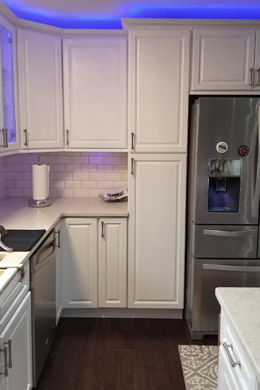 white kitchen cabinets with quartz countertops featured with Blue Lighting Fixtures