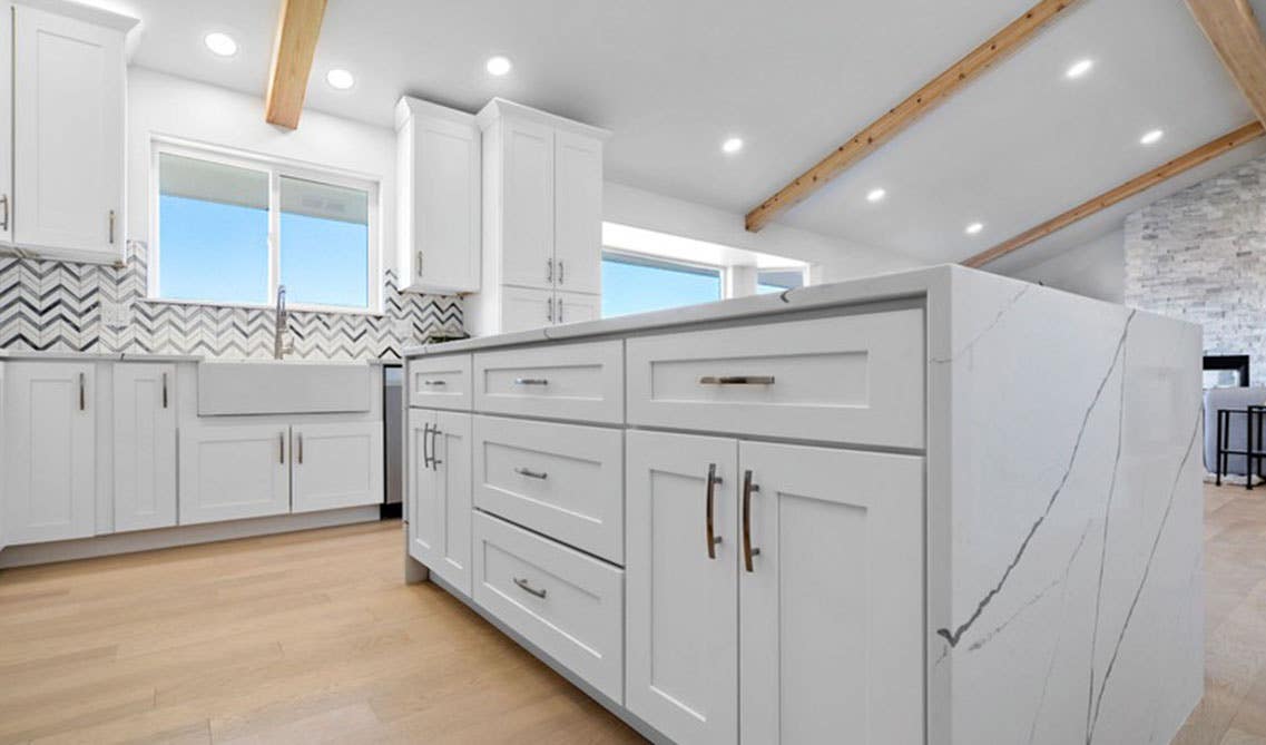 Stylish white kitchen design with SPC flooring 