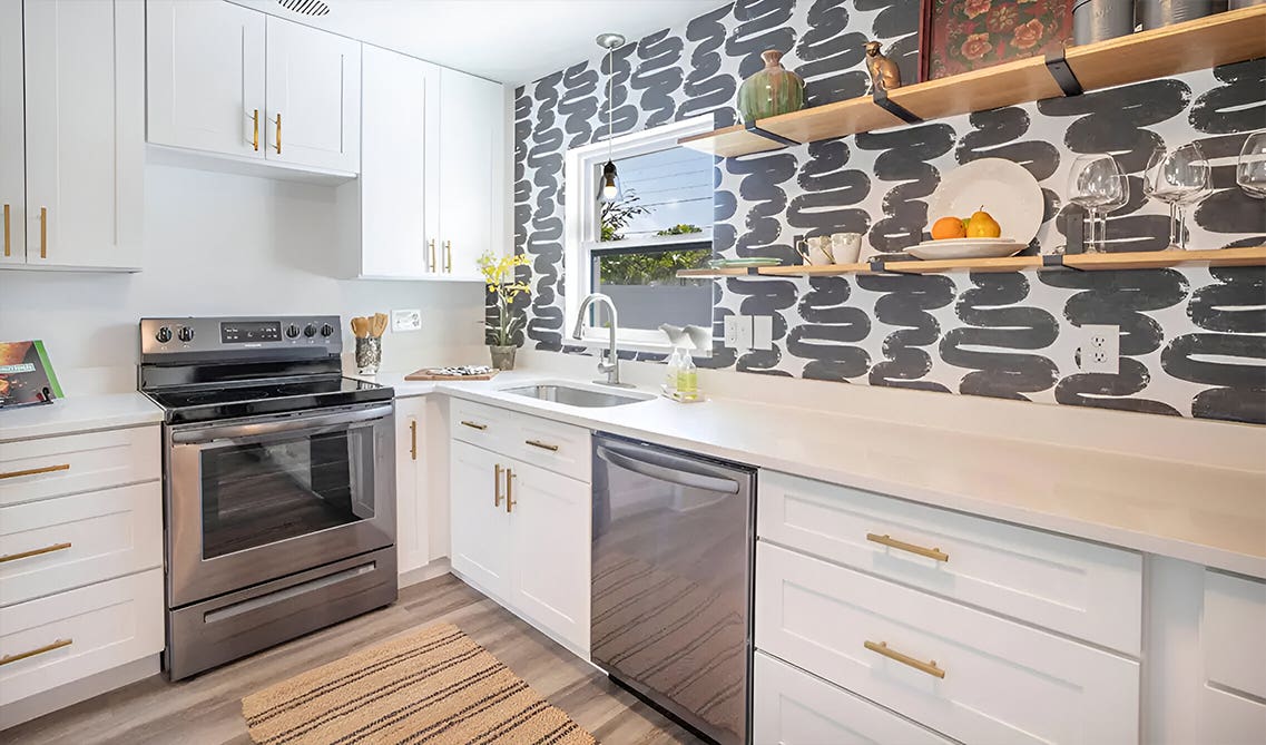 White kitchen with decorative wallpaper