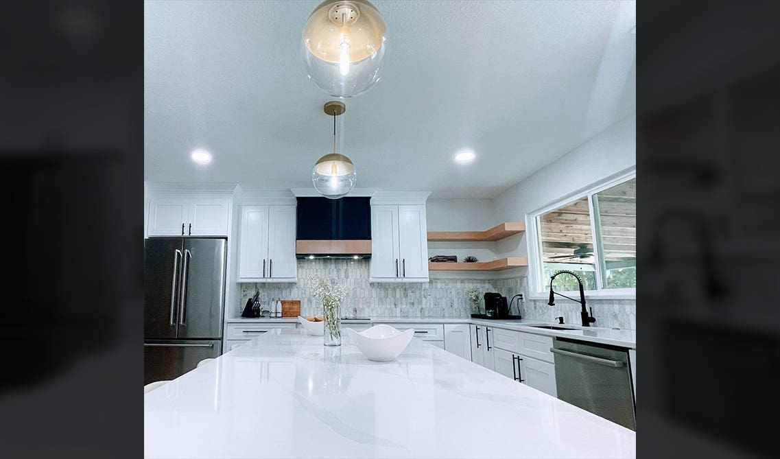 White shaker cabinets with large countertop