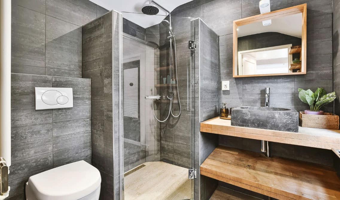 rustic style bathroom feature open wood shelves storage and black sink with steel faucet and separate shower area