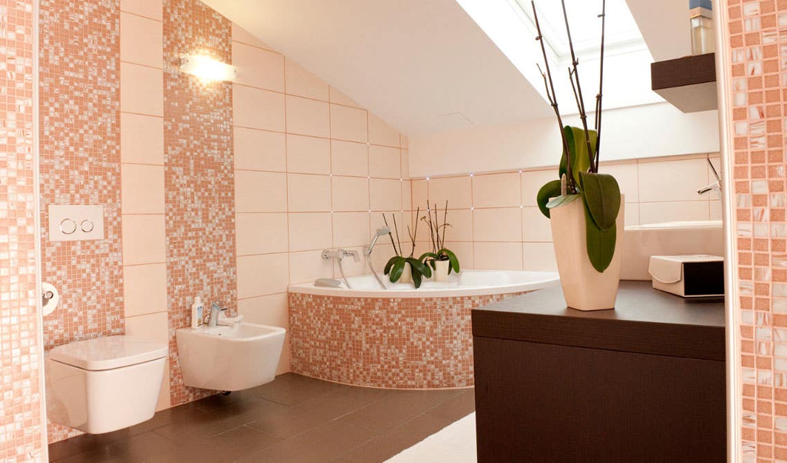 Beautiful Bathroom design with corner jacuzzi, pattern tile on wall and, wall mount toilet and sink