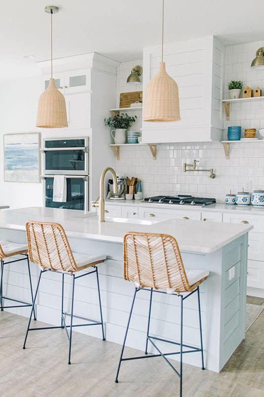 Modern kitchen style with white cabinets, functional island and Woven pendant kitchen