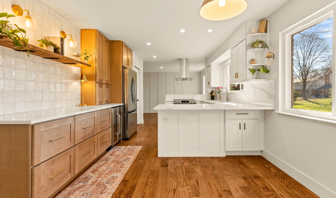 Brown and white kitchen paired with wooden accent and warm lighting 