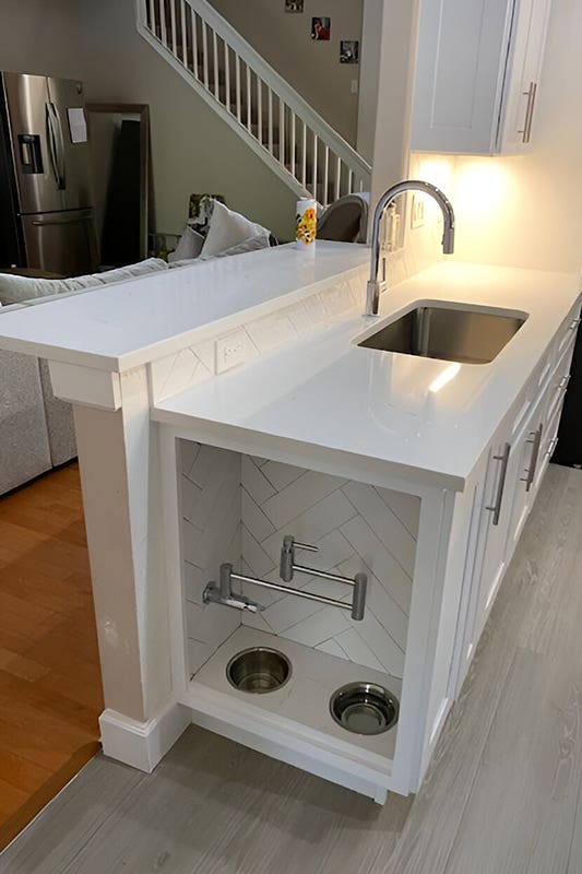 Built in dog bowls kitchen island and incorporated sink