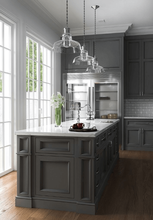 grey kitchen cabinet with matching grey island and french doors, wood floors