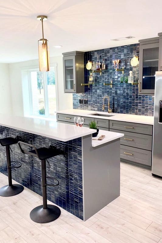 Dining Table with White Countertop, Gray Cabinets with golden Hardware