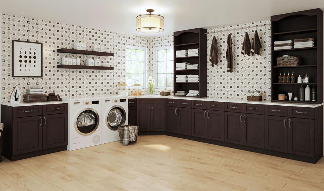 Laundry room with dark cabinets, open shelves, washer and dryer, print wallpaper and spc flooring