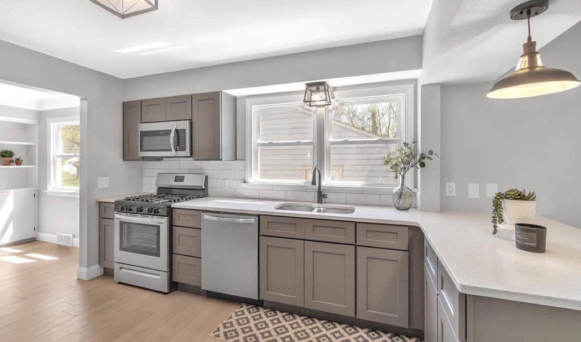 Grey Shaker cabinets with white countertops 