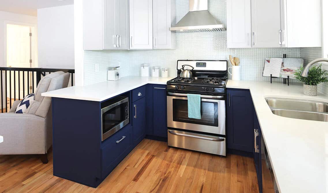 Modern kitchen with white and navy blue cabinets