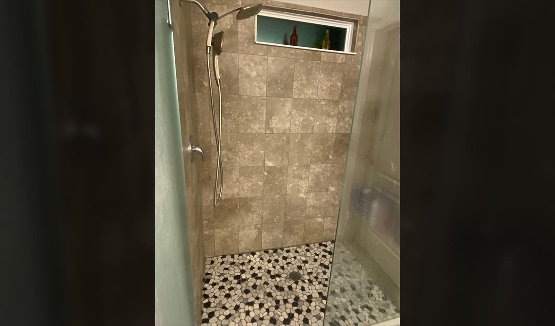 subway tile is the best option for the shower walls and the floor 