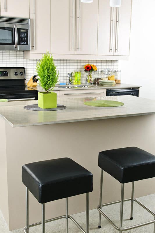 Soapstone countertops with cream cabinets