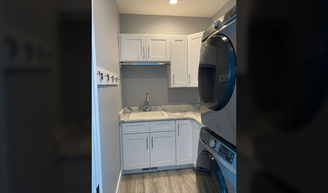 Laundry room with storage cabinets