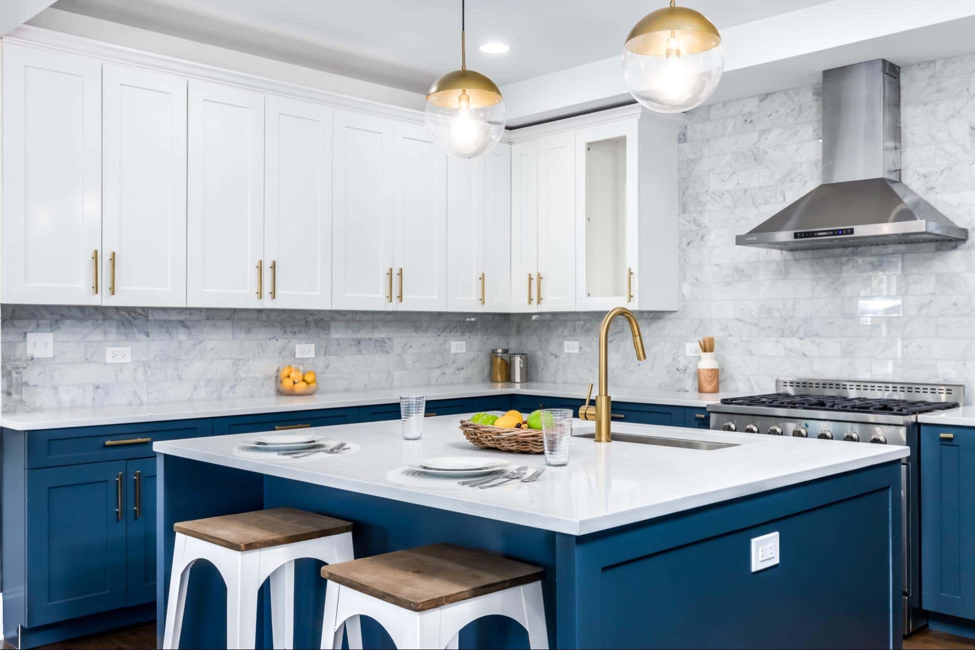 Kitchen with modern blue and white cabinets