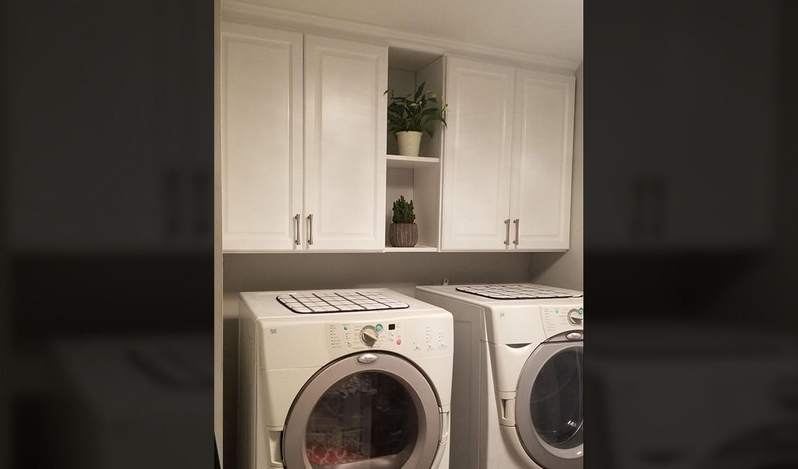 White wall cabinets with Washer and Dryer