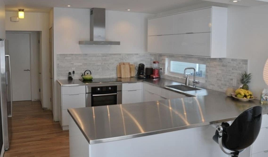 Stainless steel countertops with flat Door white cabinets