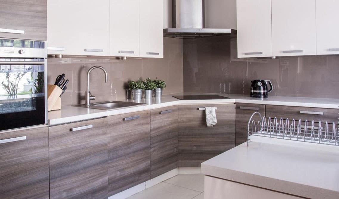 Modern Kitchen Design with frameless two tone cabinets, and stainless steel hardware