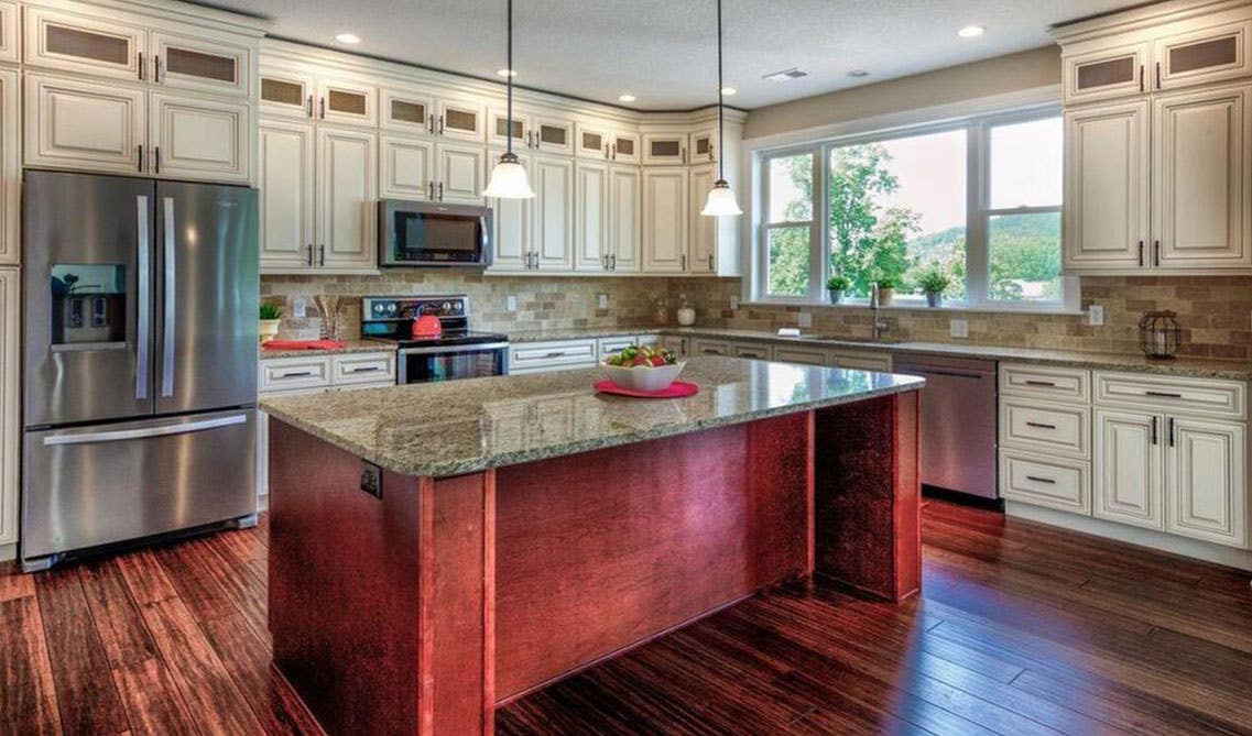 Cream kitchen cabinets with brown cabinets island kitchen design 