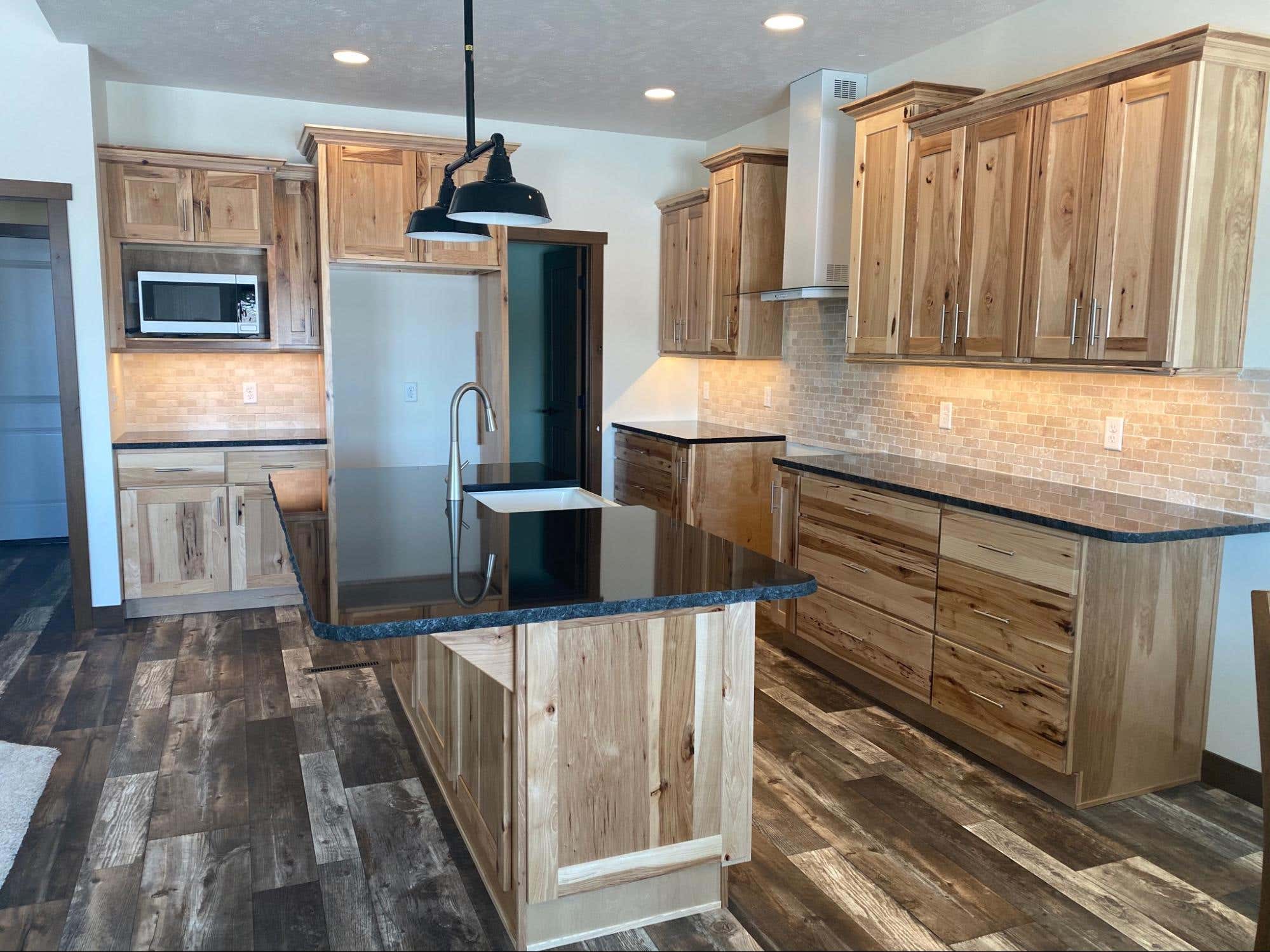 Create contrast in height by stacking cabinets