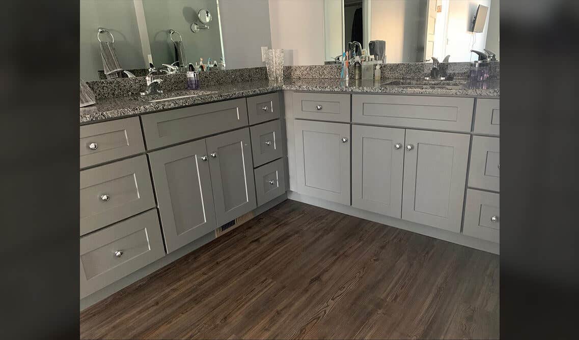 Gray bathroom vanity with big wall mirrors