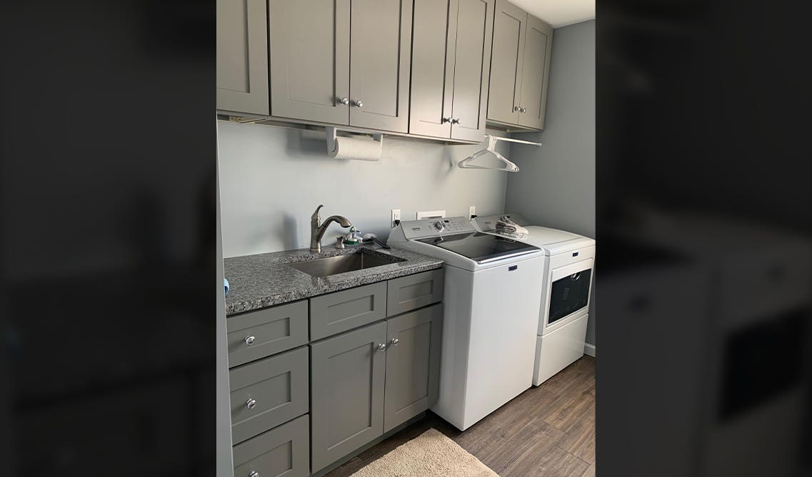 built-in storage cabinets with washer and dryer machine and wall cabinets