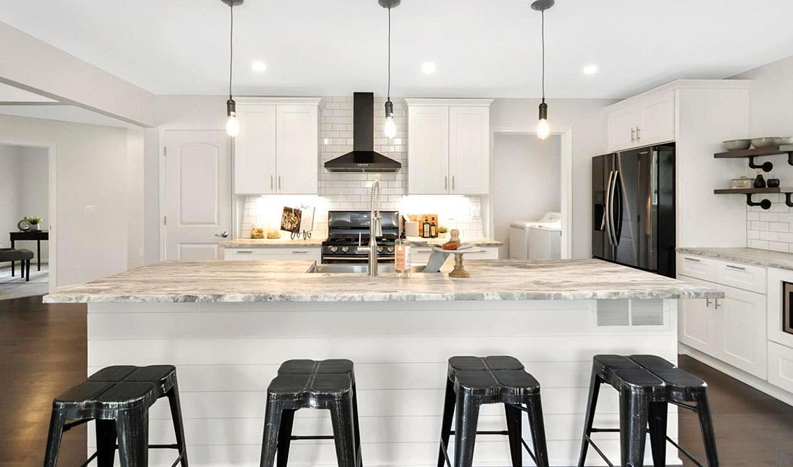 Black and White kitchen with thoughtful lighting