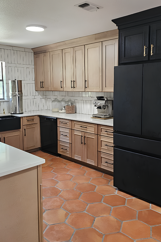 Mix modern kitchen design with black and brown cabinets, farmhouse sink and black appliances 