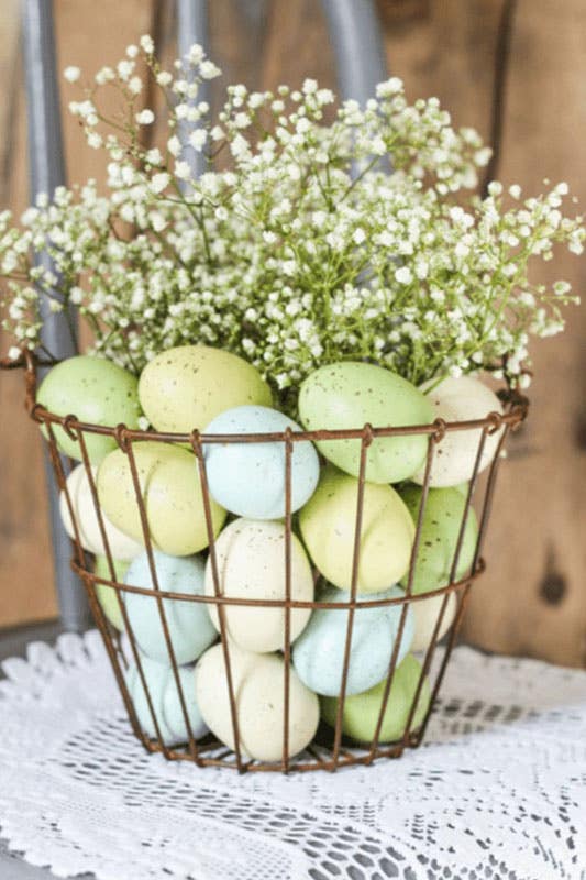 spring decor with vase filled with pastel-colored eggs