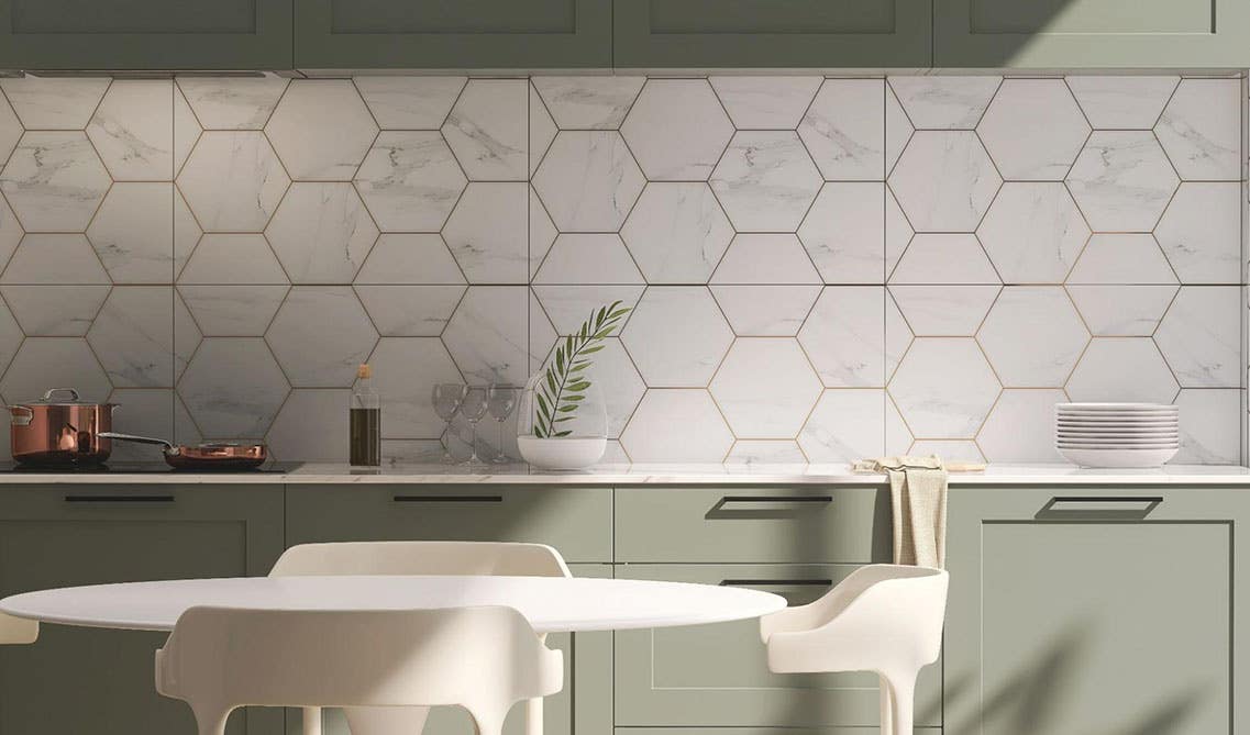 hexagonal Patterned design backsplash with green kitchen cabinets and white countertop, round table and 4 chair 