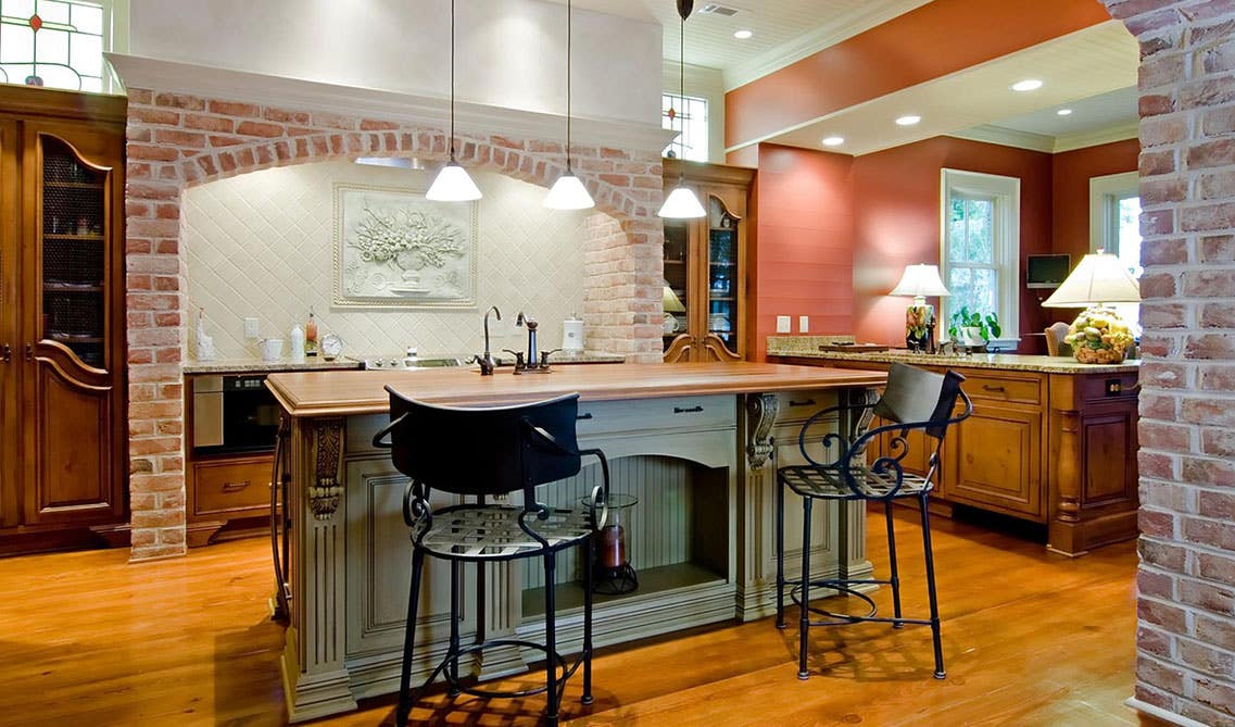  rustic sage green kitchen cabinets with a distressed wood floor and aged hardware