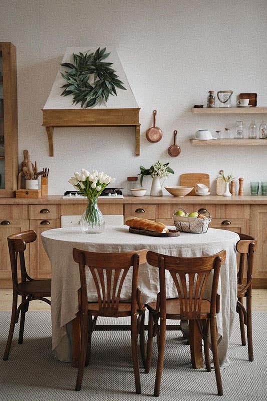 rustic style kitchen with oak cabinets, Wood hood and open shelves, 4 chair dining table