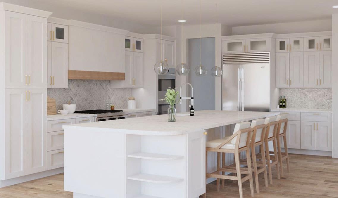 Stunning white cabinets with large white island, wooden chair, pendant lights, 