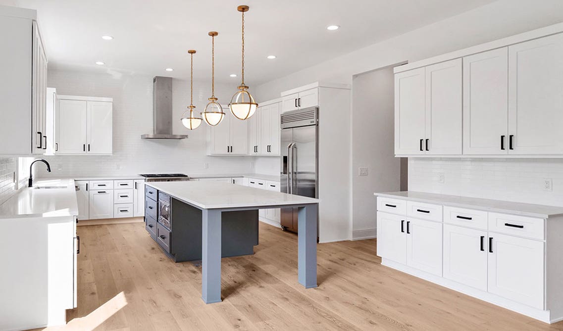 Modern white kitchen with cabinets and large island 