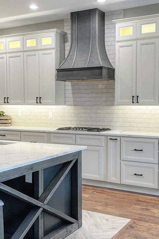 york linen cabinets with rustic black accents like, island, hood, pulls 