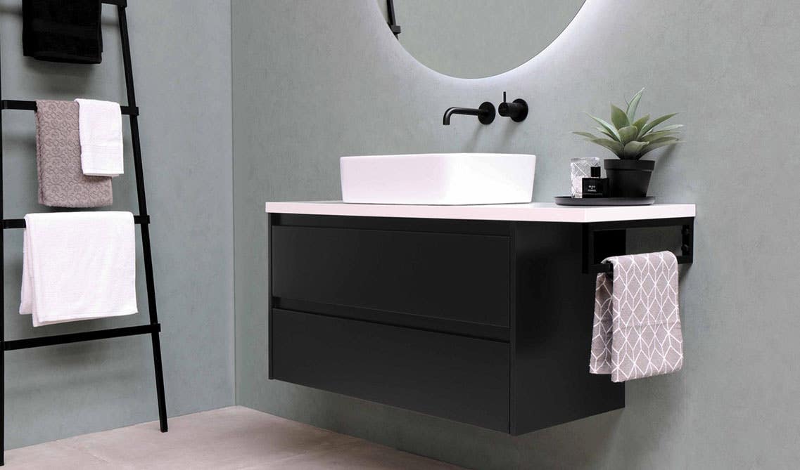 wall mounted bathroom cabinets with white sink and big round mirror