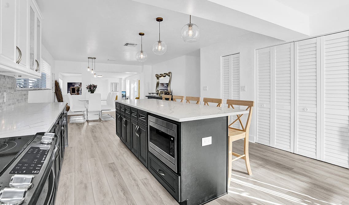 two toned kitchen cabinet with white Kitchen island