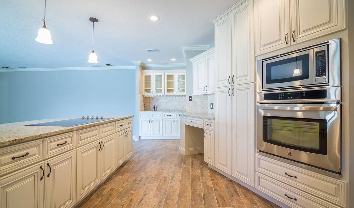 spacious kitchen design with wooden floor